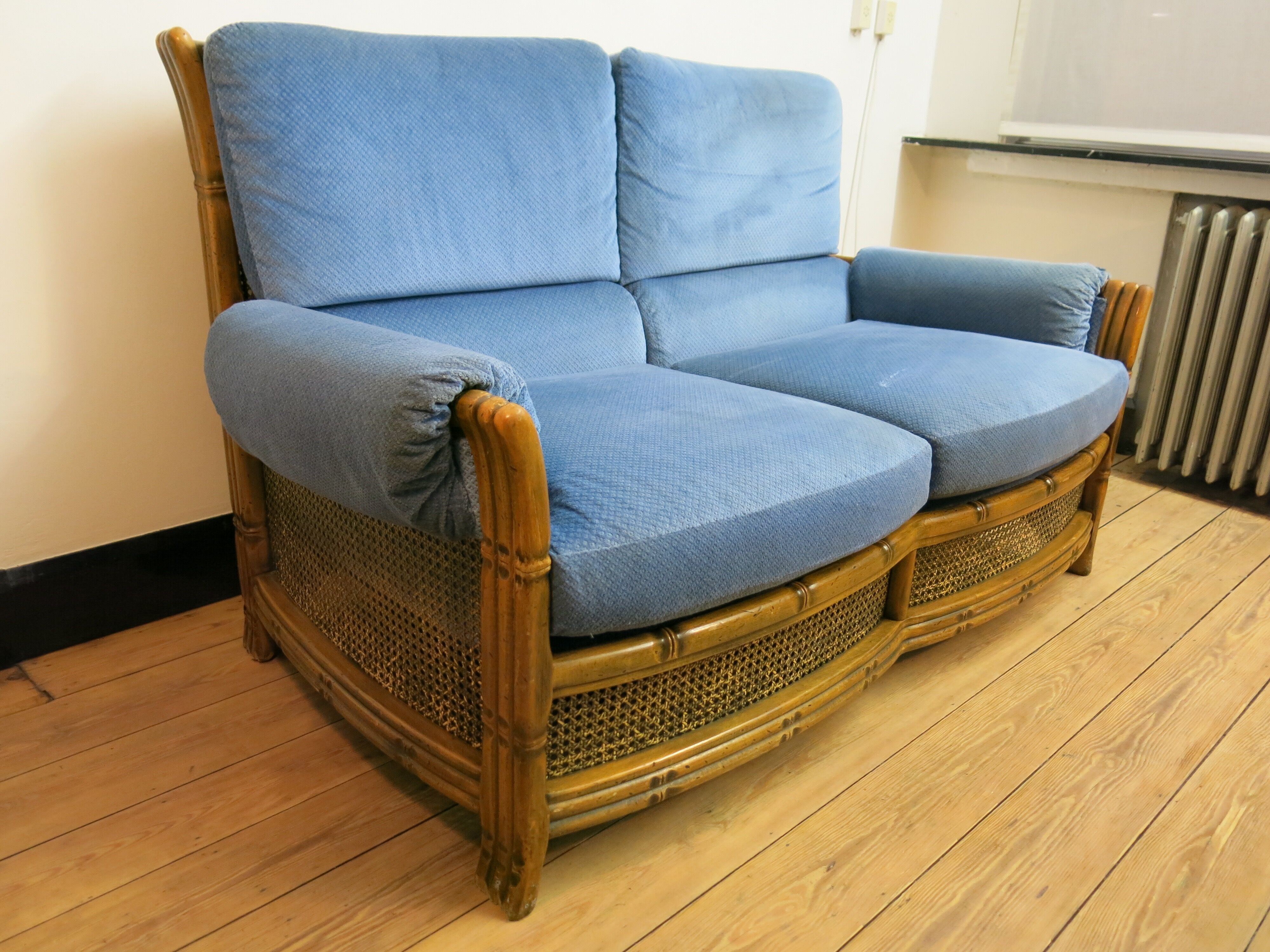 Colonial sofa two places in cannage and carved wood