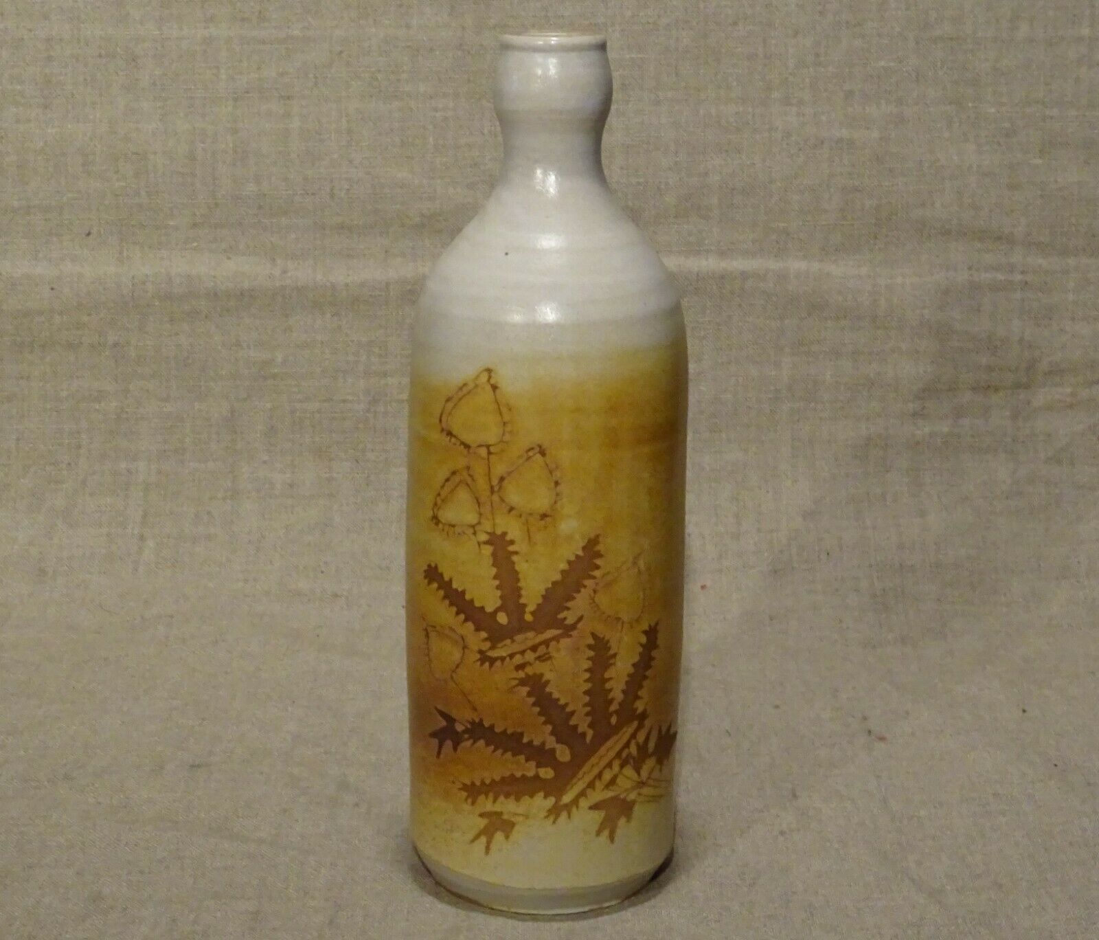 Bottle decorated with Vallauris foliage