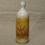 Bottle decorated with Vallauris foliage