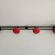 Wall-mounted coat rack in black and red metal (4 hooks)