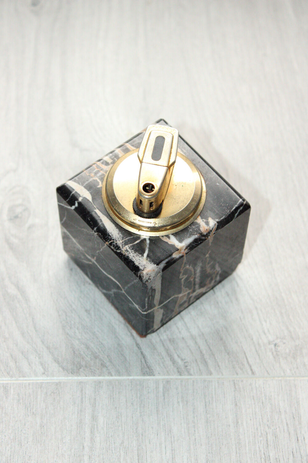 Vintage table lighter in black marble and brass