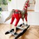 Large decorative rocking horse made of carved and hand-painted wood.