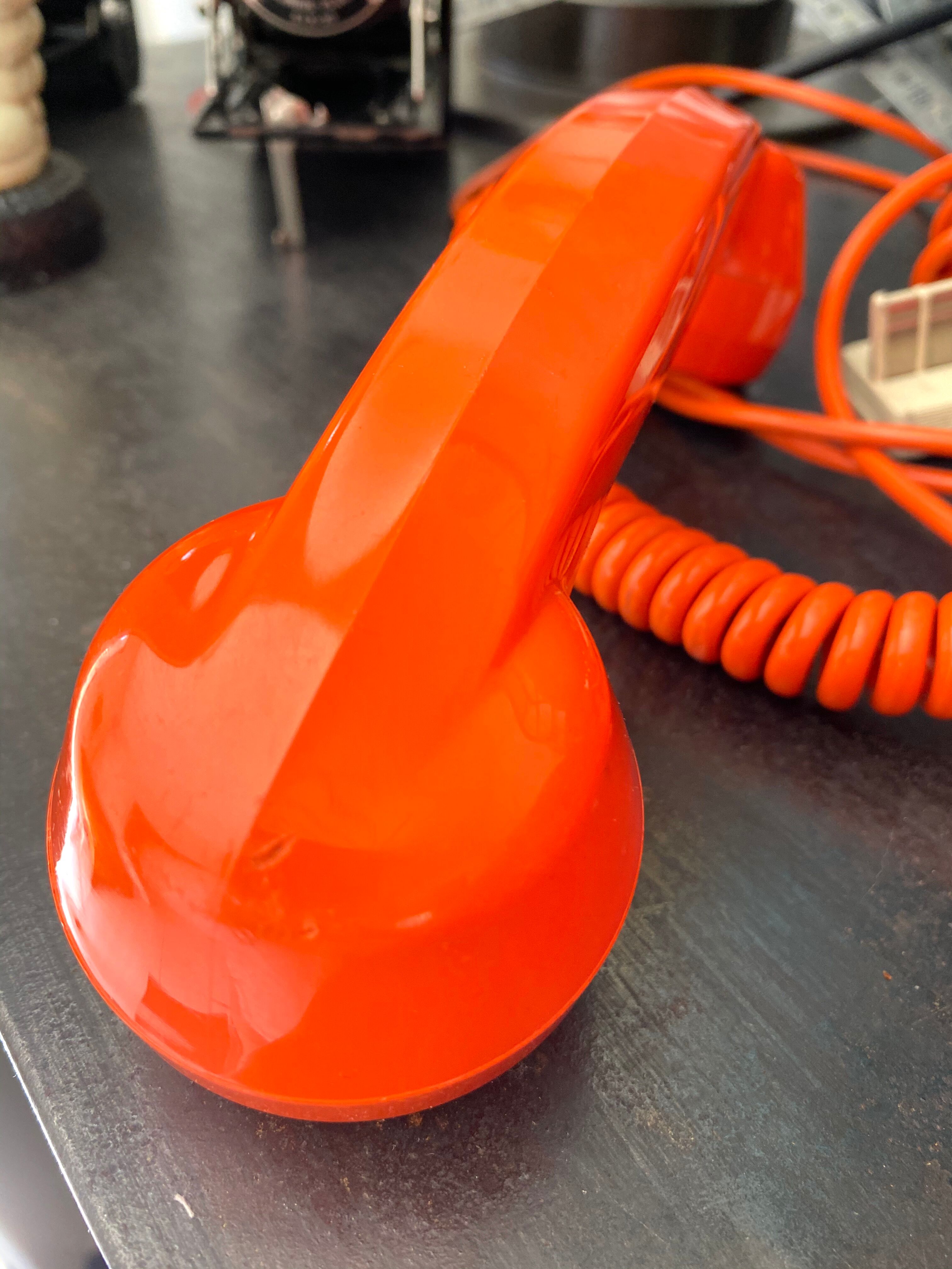 Orange vintage dial phone