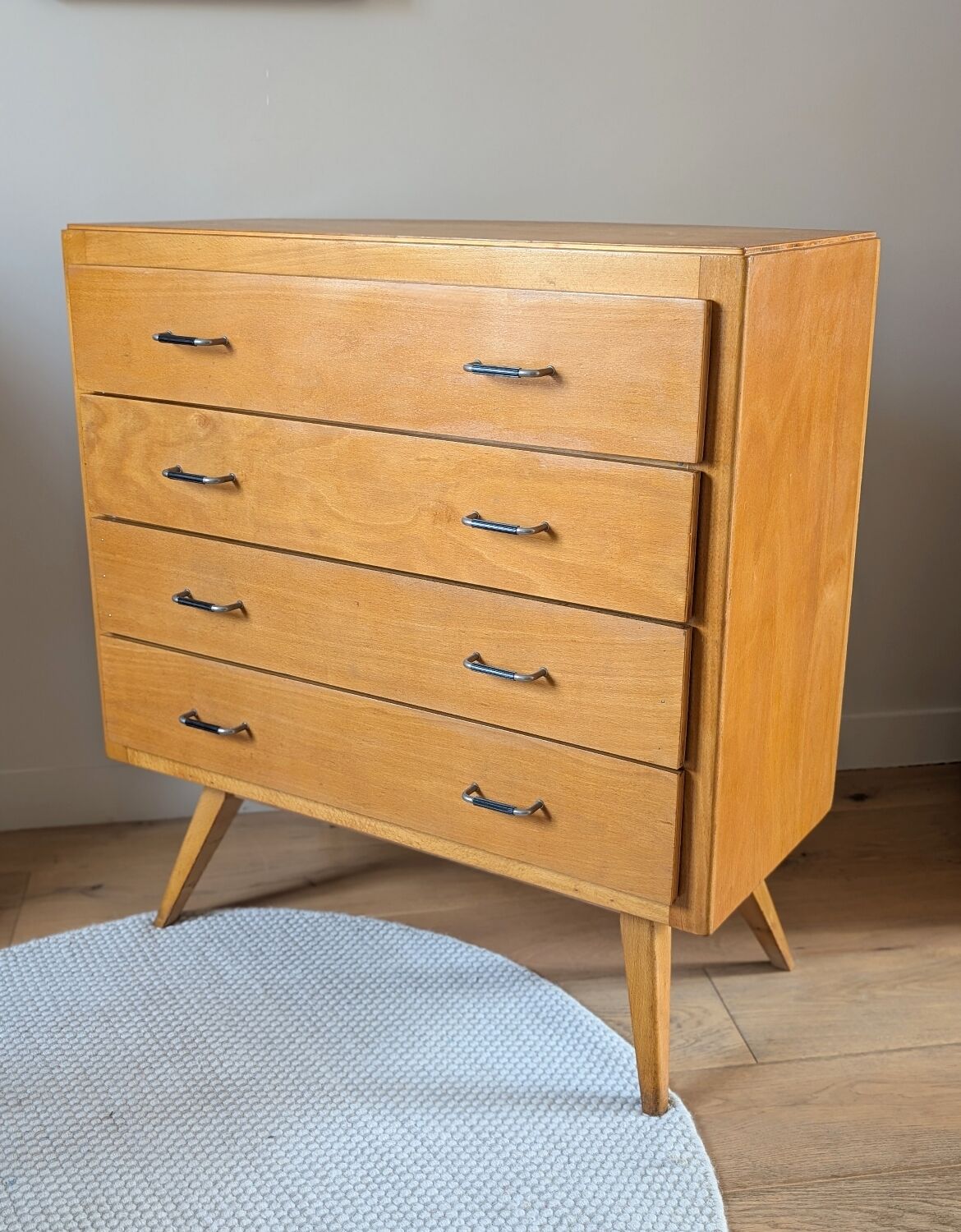 Vintage chest of drawers with tapered legs from the 1960s.