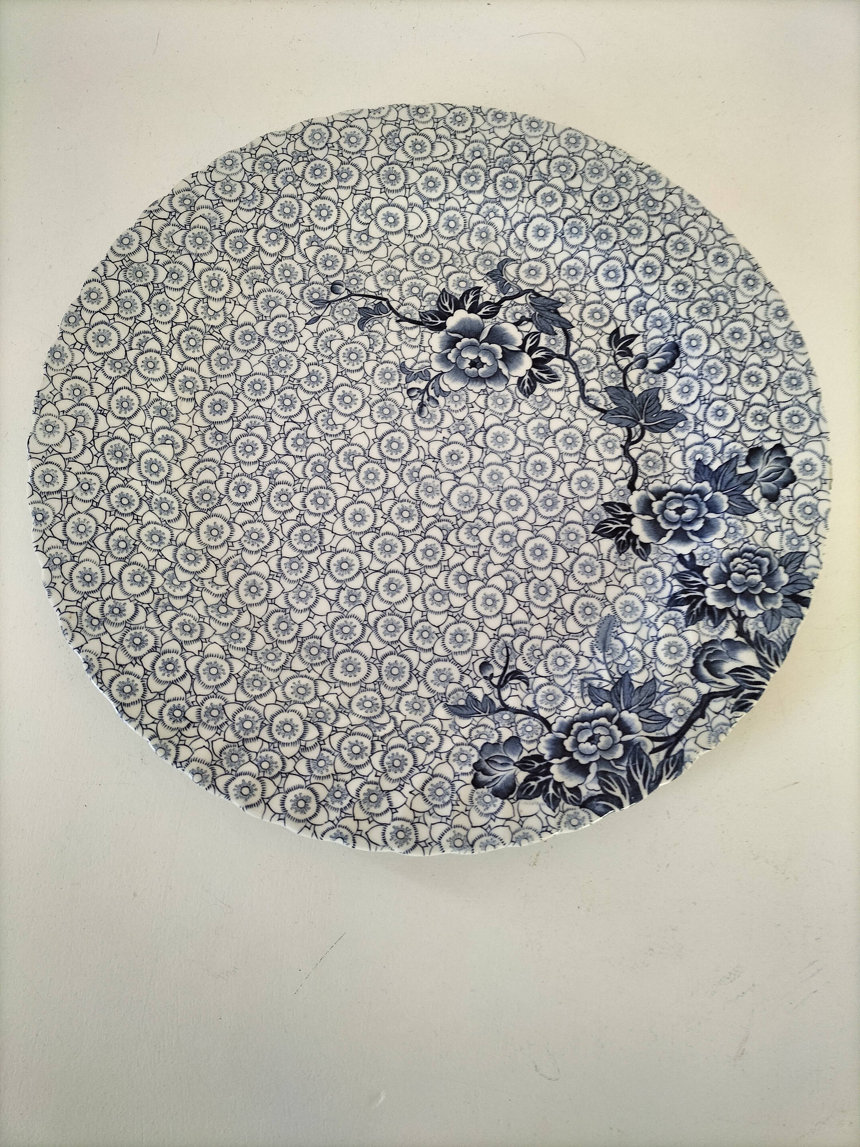 Round antique plate by Johnson Brothers in the Blue Lotus pattern.