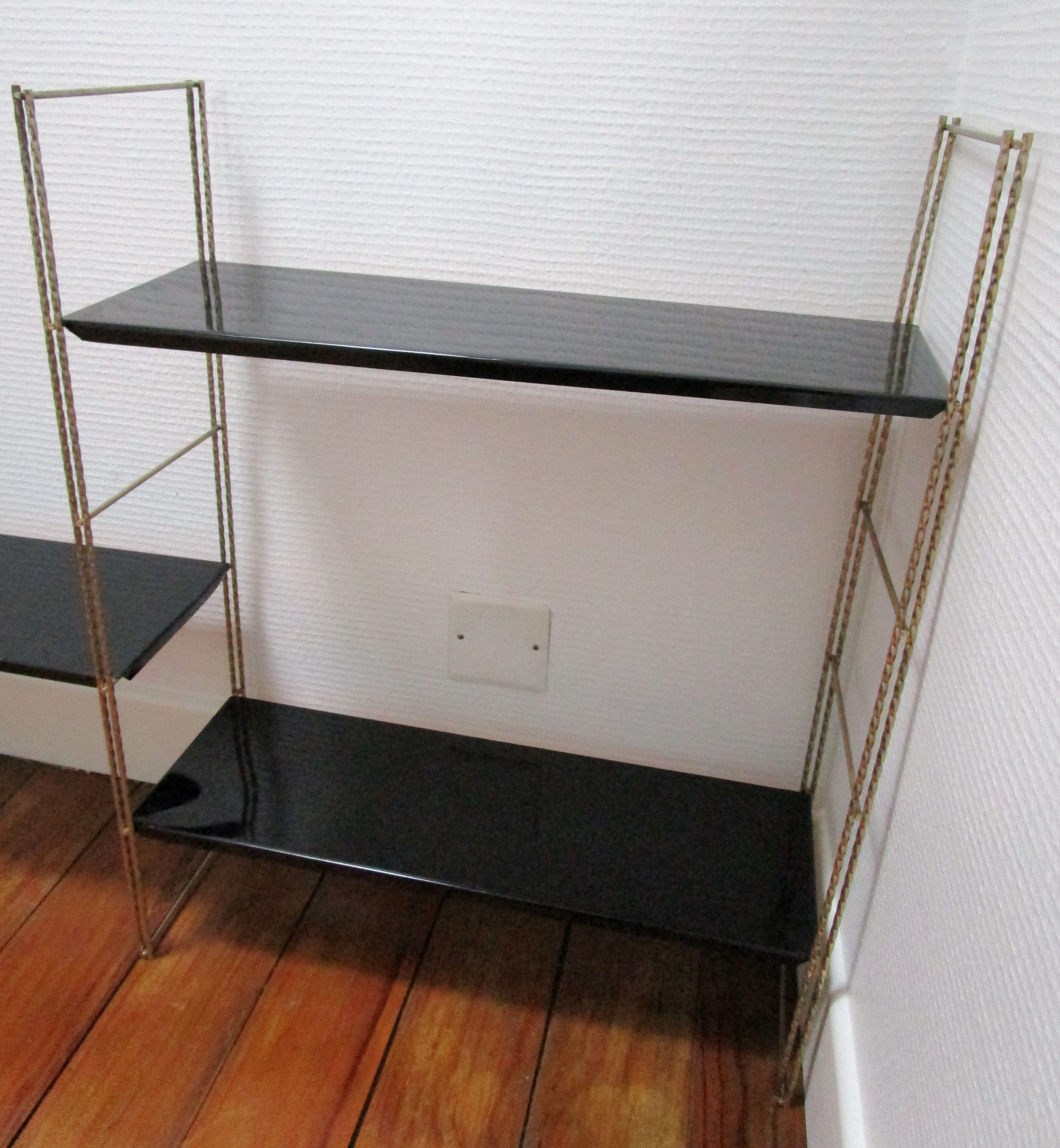 Black and gold metal tomado wall shelf