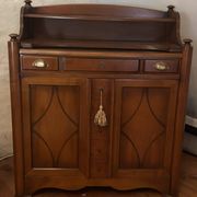 Vintage drop-leaf secretary with a green leather top and inlays.