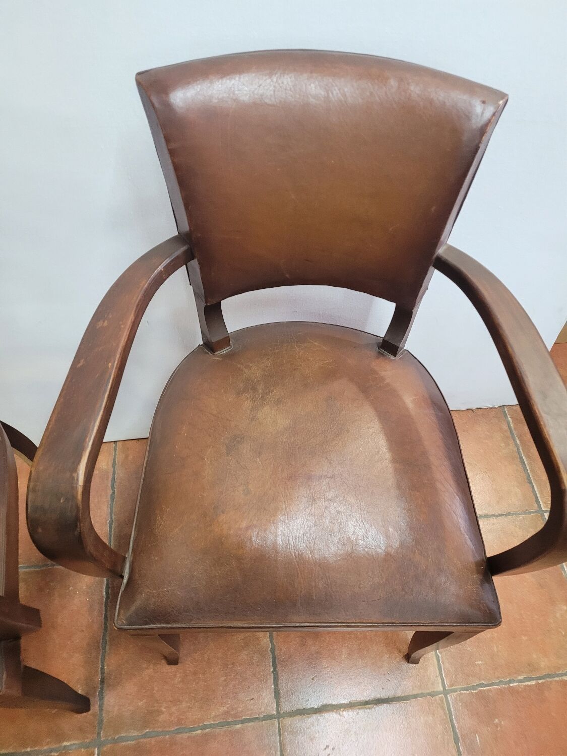 Pair of antique leather bridge armchairs