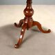 Antique round walnut table with a baluster central leg, Italy, 19th century.