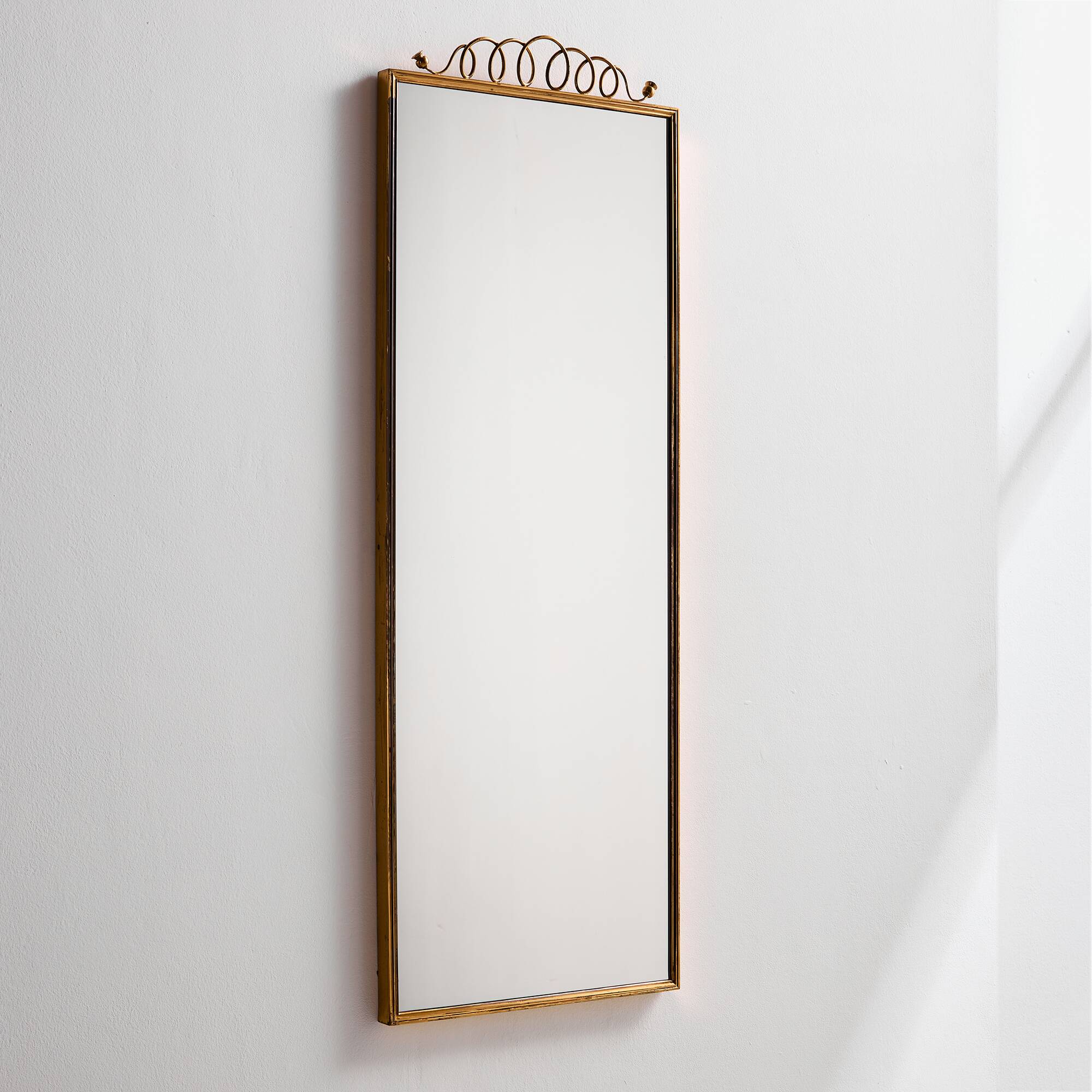 Metal and brass framed mirror