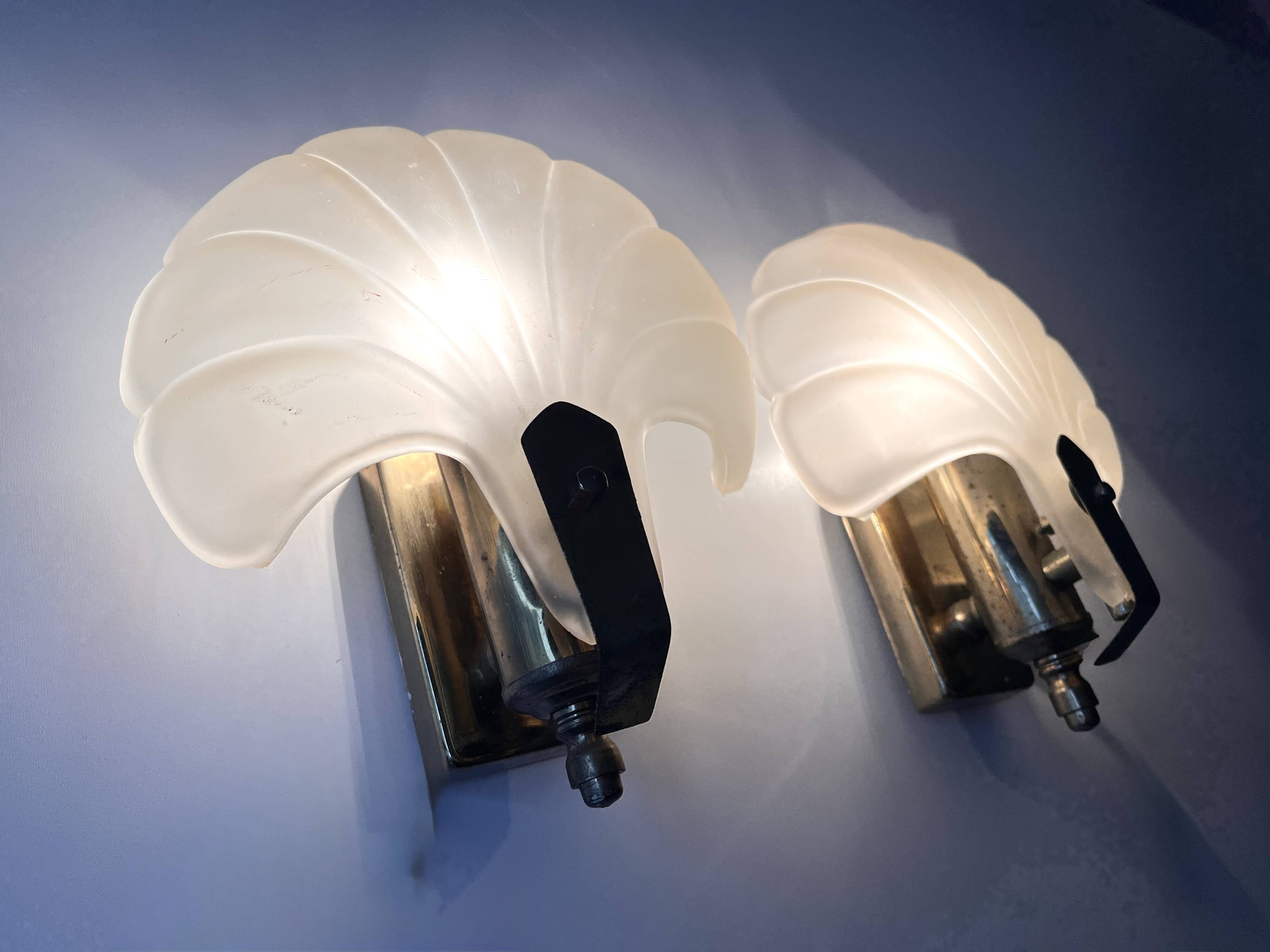 Pair of vintage shell glass wall lights, Art Deco style fixtures.