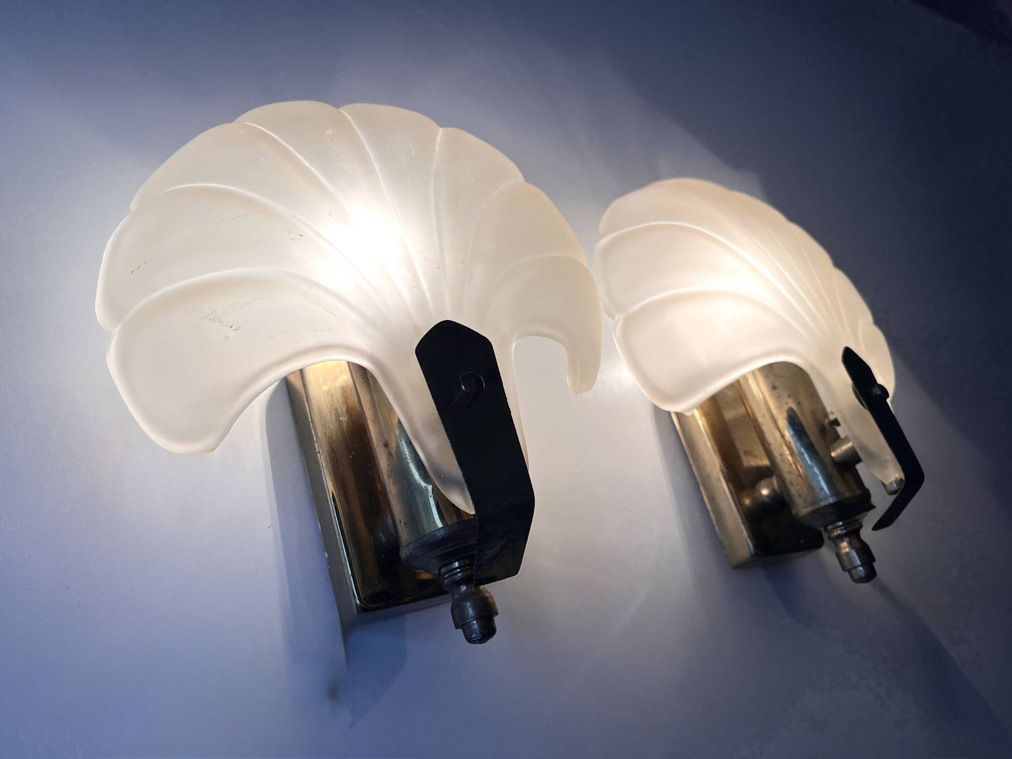 Pair of vintage shell glass wall lights, Art Deco style fixtures.