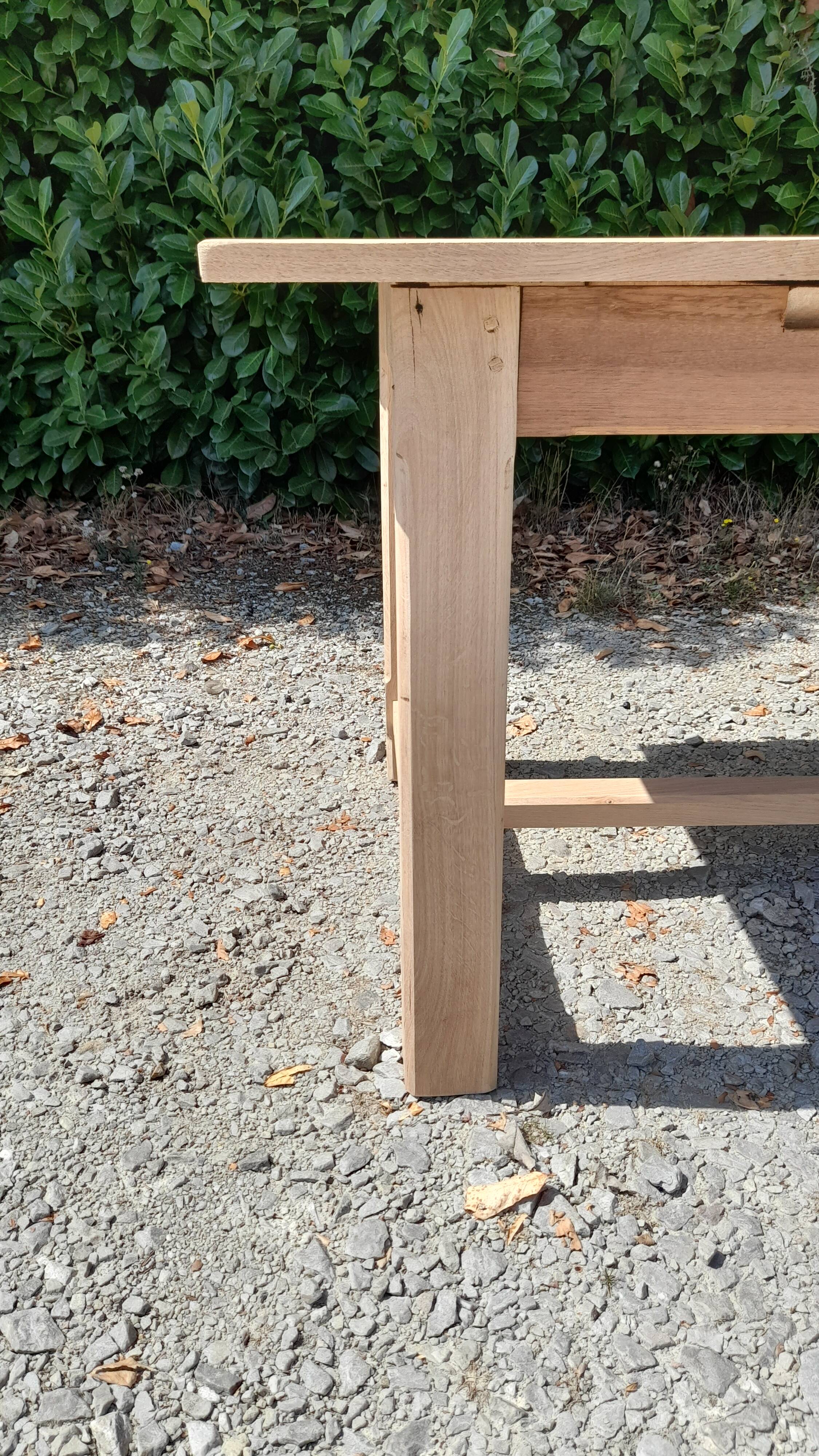 Solid oak farmhouse table in raw wood