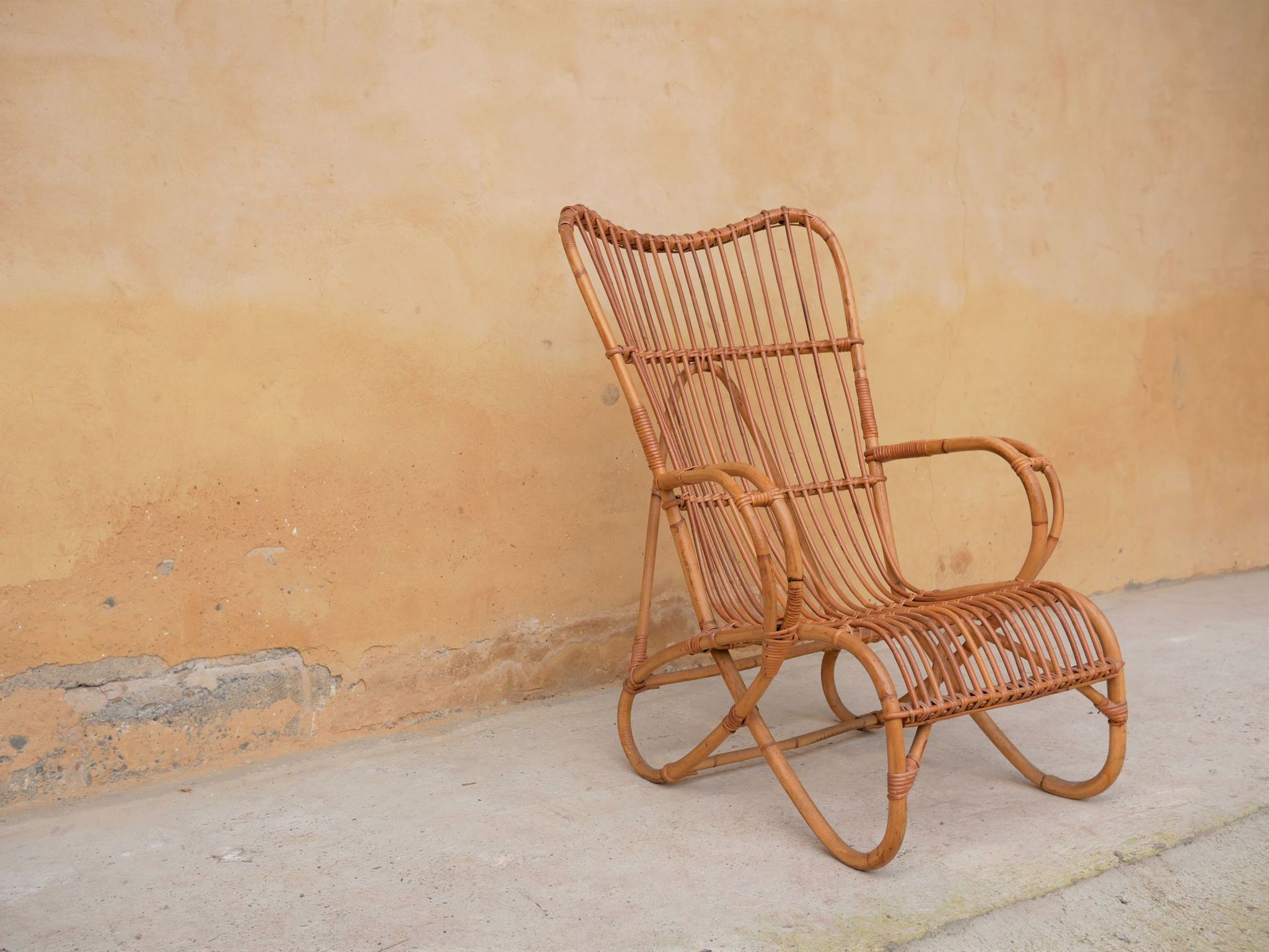 Vintage rattan chair by Louis Sognot