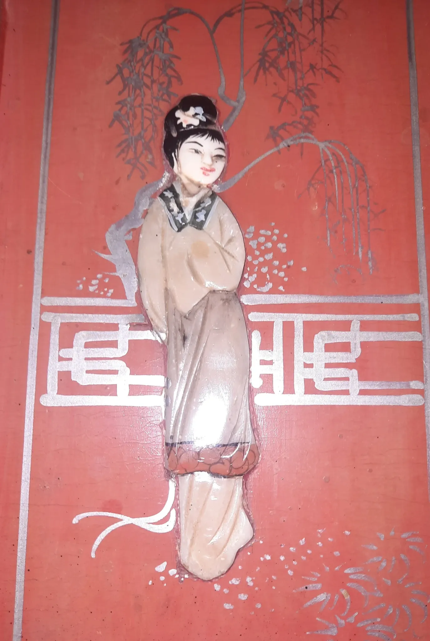 Red lacquered wooden mallet from the Far East.
