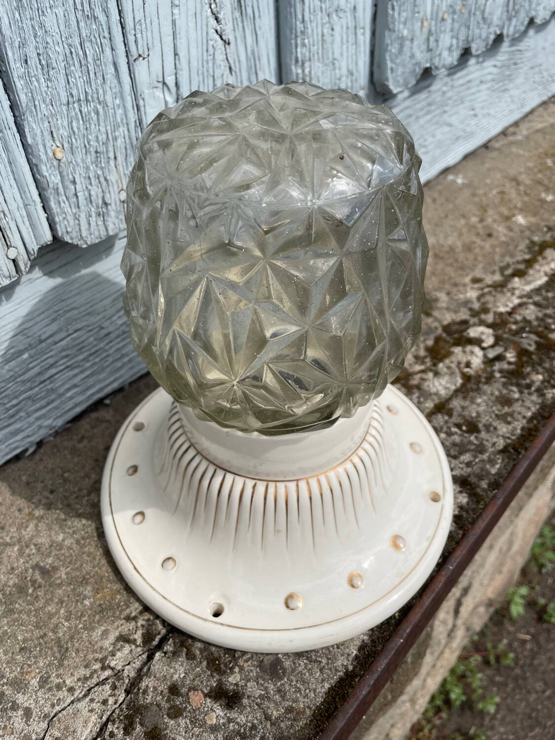 Art Deco ceiling light with a porcelain base.