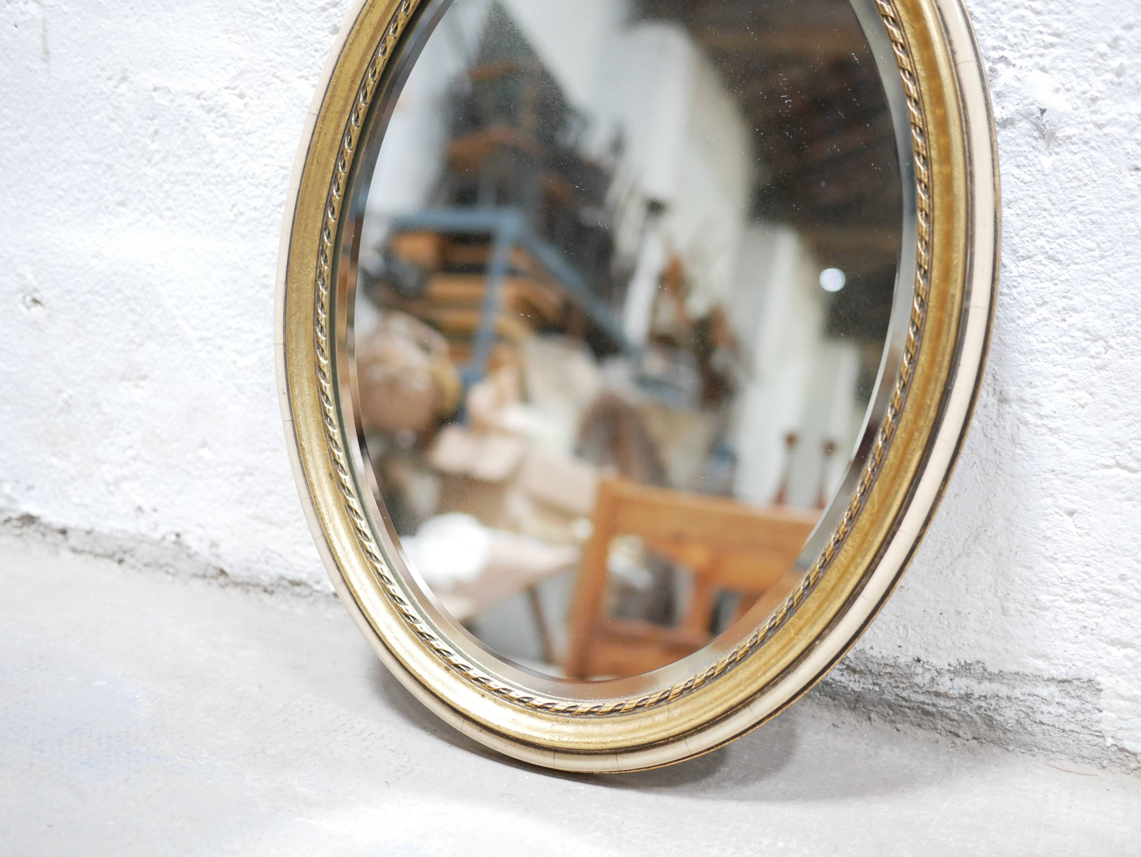 Old oval mirror Louis XVI style in gilded wood 50cm x 34cm