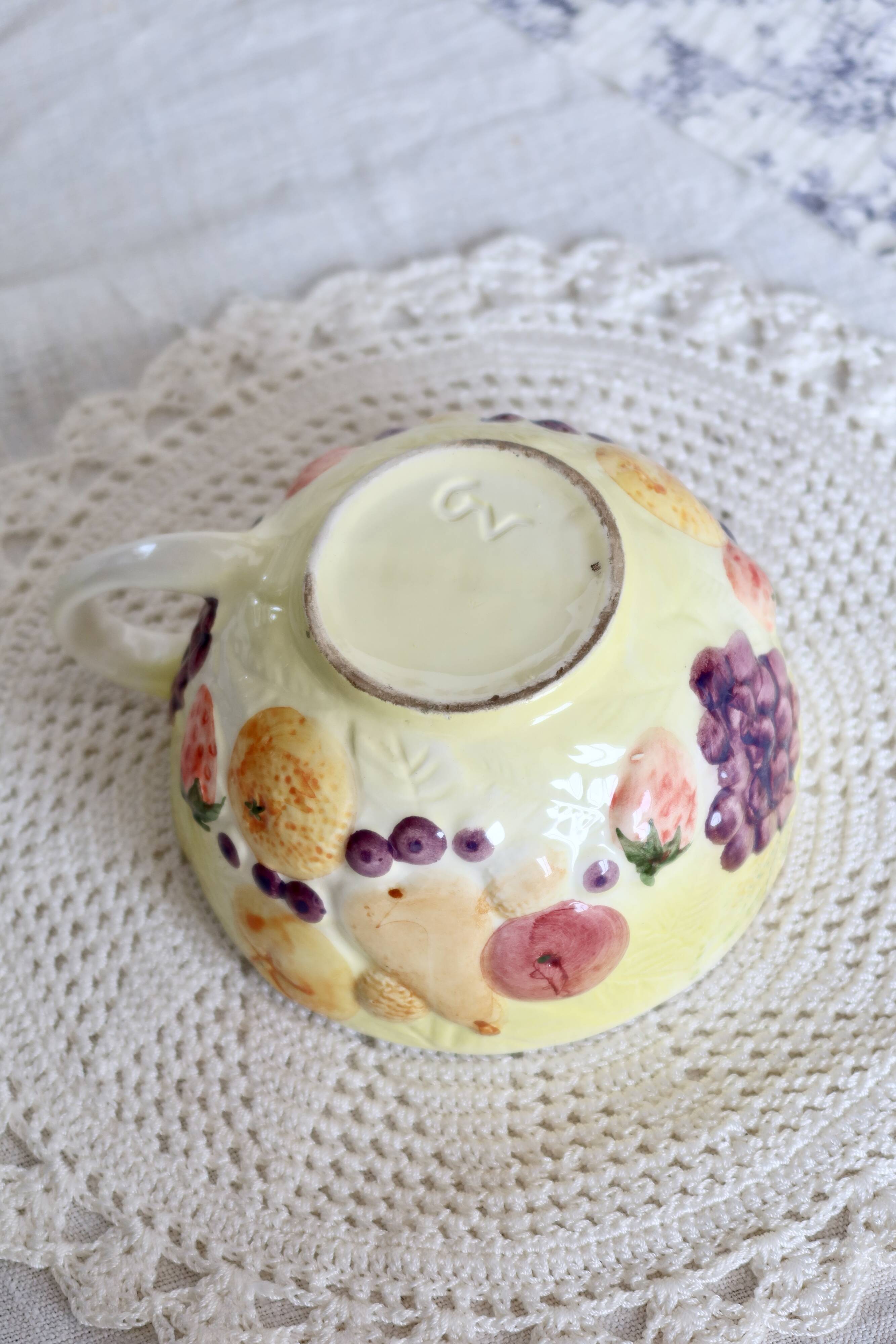 Large vintage earthenware mug with fruit motif and slip details