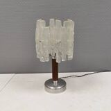 Table lamp with a teak ‘trunk’, silver-coloured metal base, acrylic shade