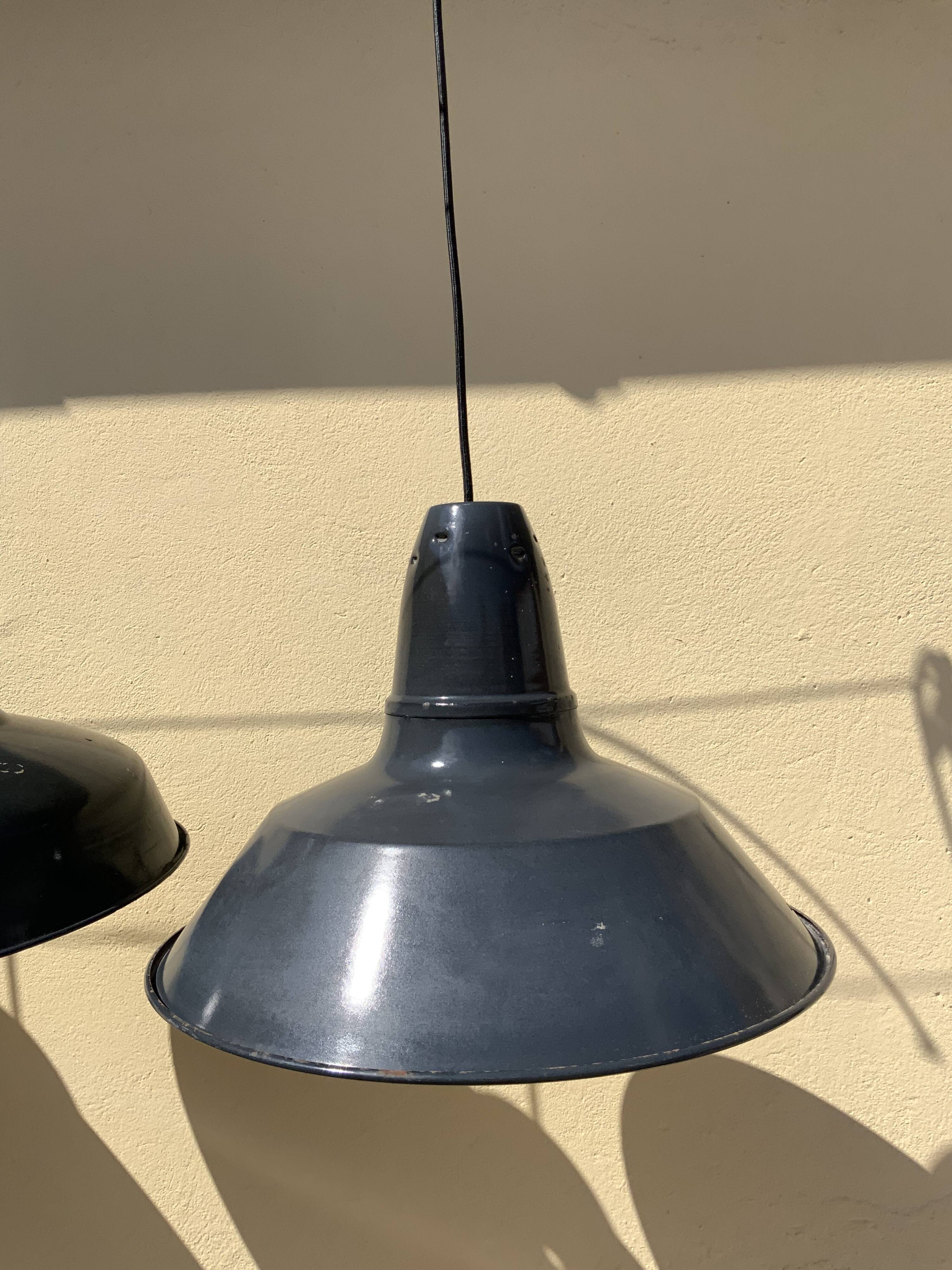 Three industrial suspensions in black and white enamelled sheet metal large format