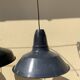 Three industrial suspensions in black and white enamelled sheet metal large format