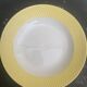 Two earthenware dishes, one hollow and one white cake dish with yellow border