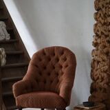 Victorian mahogany armchair, with wheels and coloured fabric, England, early 1900s.
