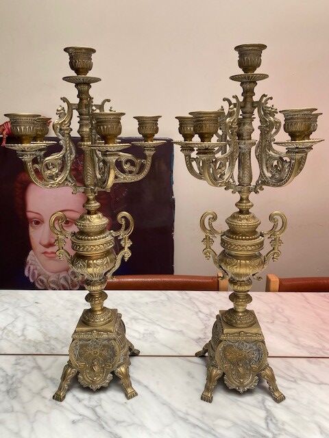 Fireplace trim clock and adornment of antique bronze candelabra
