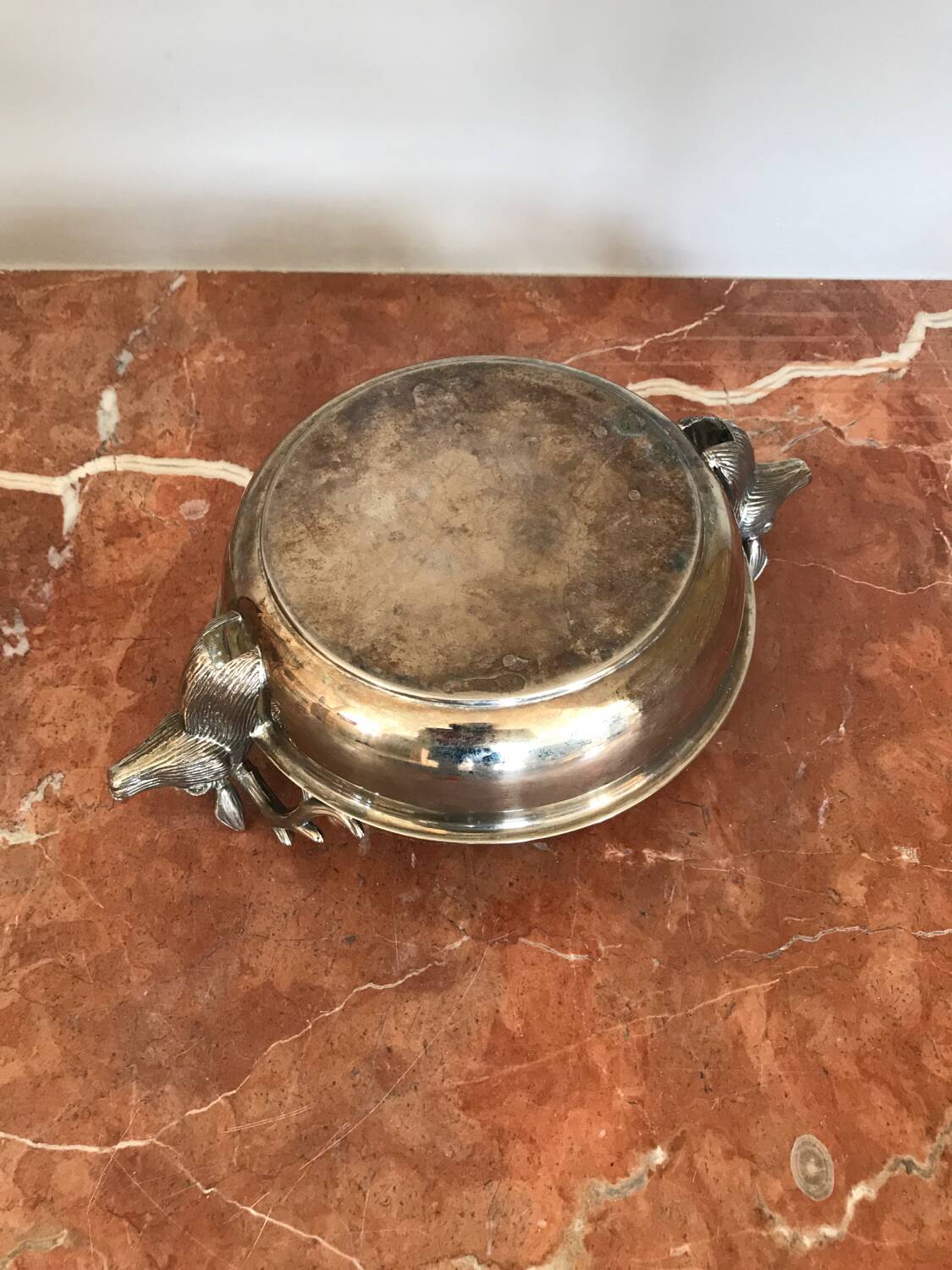 Empty silver metal pocket with deer heads