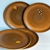 Quatre assiettes de potier en grès émaillé vintages