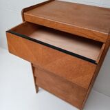 High wooden chest of drawers in the 50s