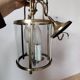 Cylindrical brass and glass lantern in Louis XVI style.