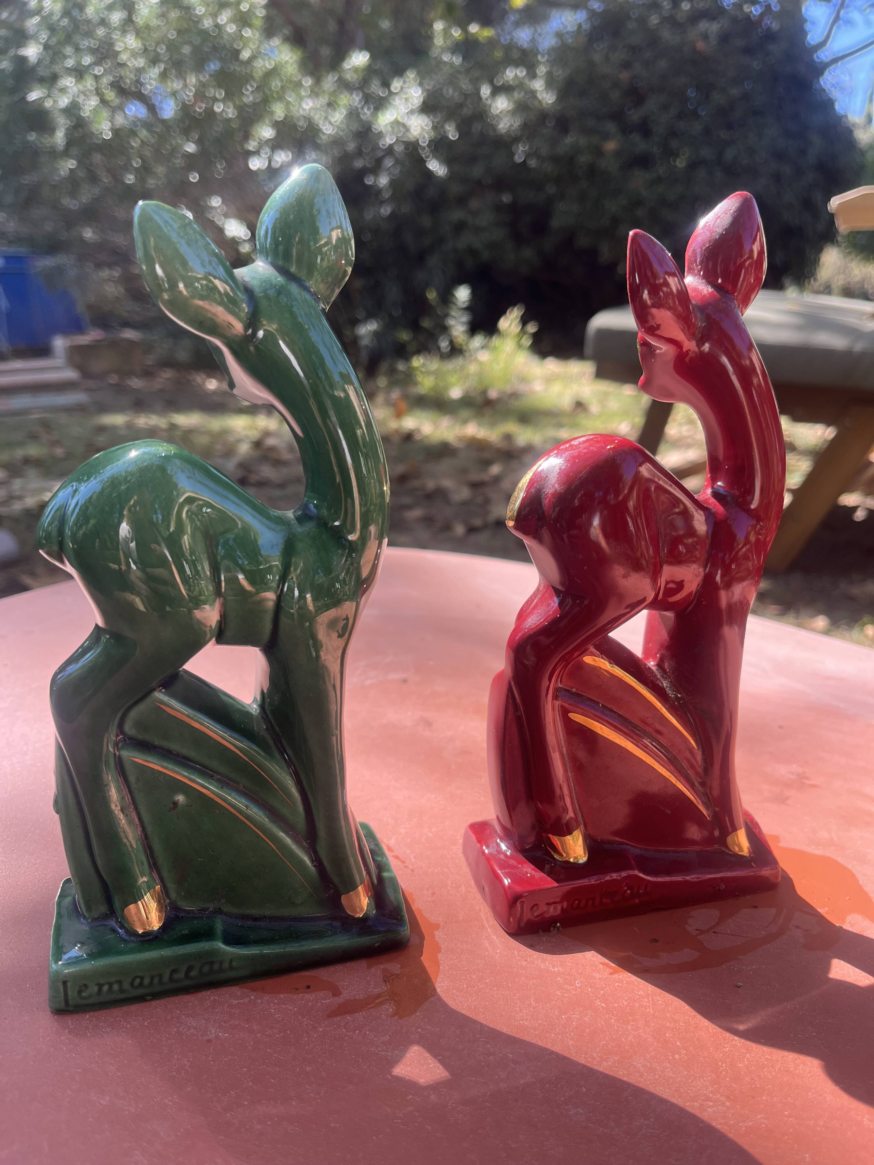 Pair of Art Deco deer by Charles Lemanceau in red and green ceramic.