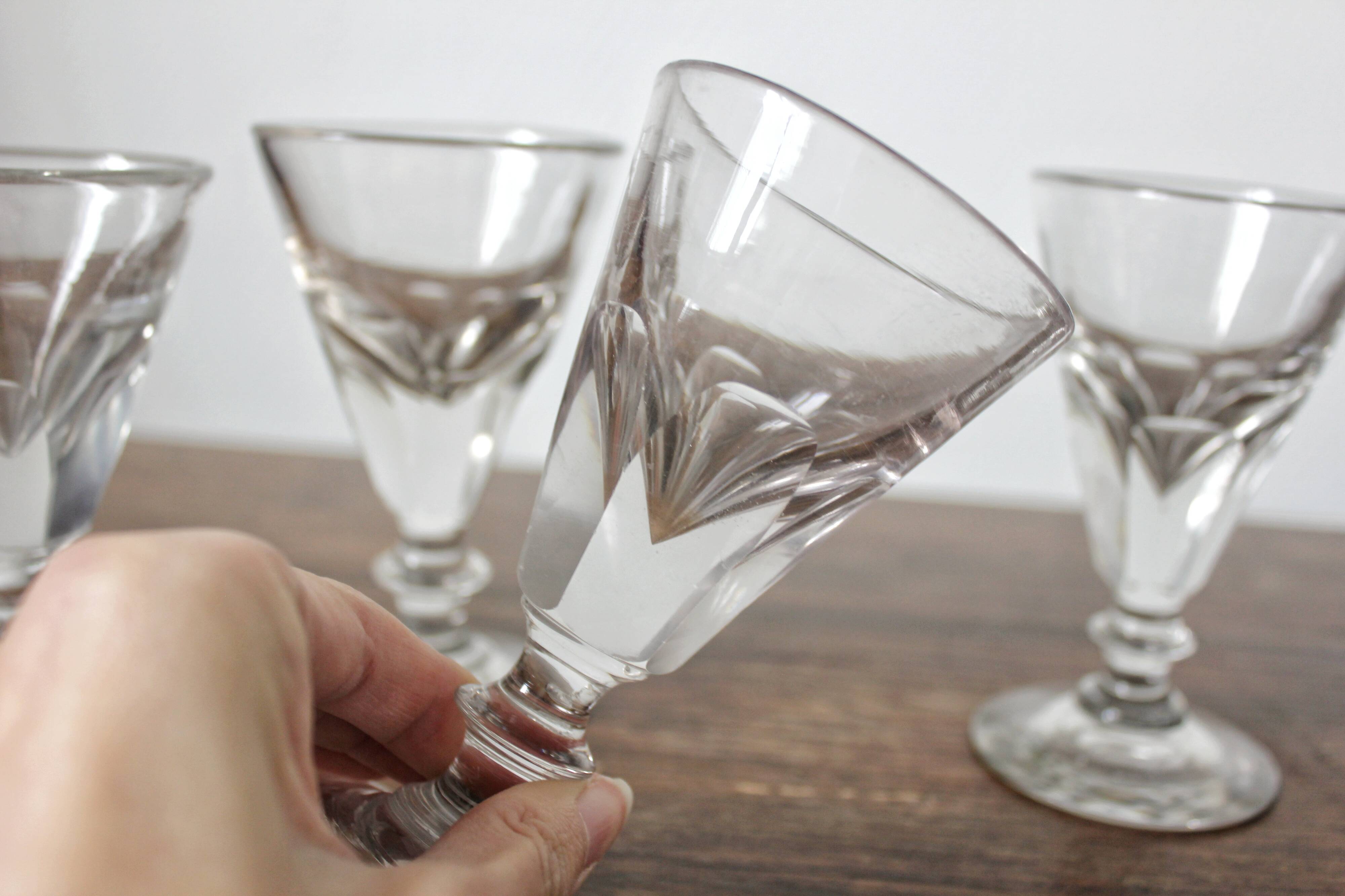 4 antique stemmed wine glasses with flat sides, made of blown glass from the 19th century