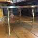 Table basse en bronze doré, verre façon miroir doré, circa 1940