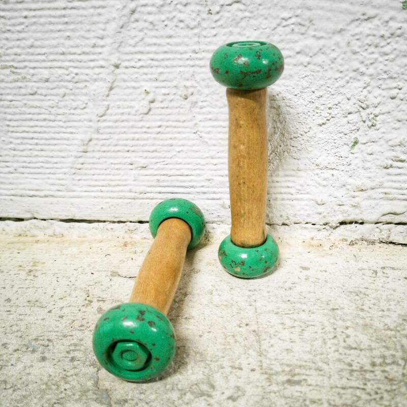 Pair of vintage cast iron and wood dumbbells