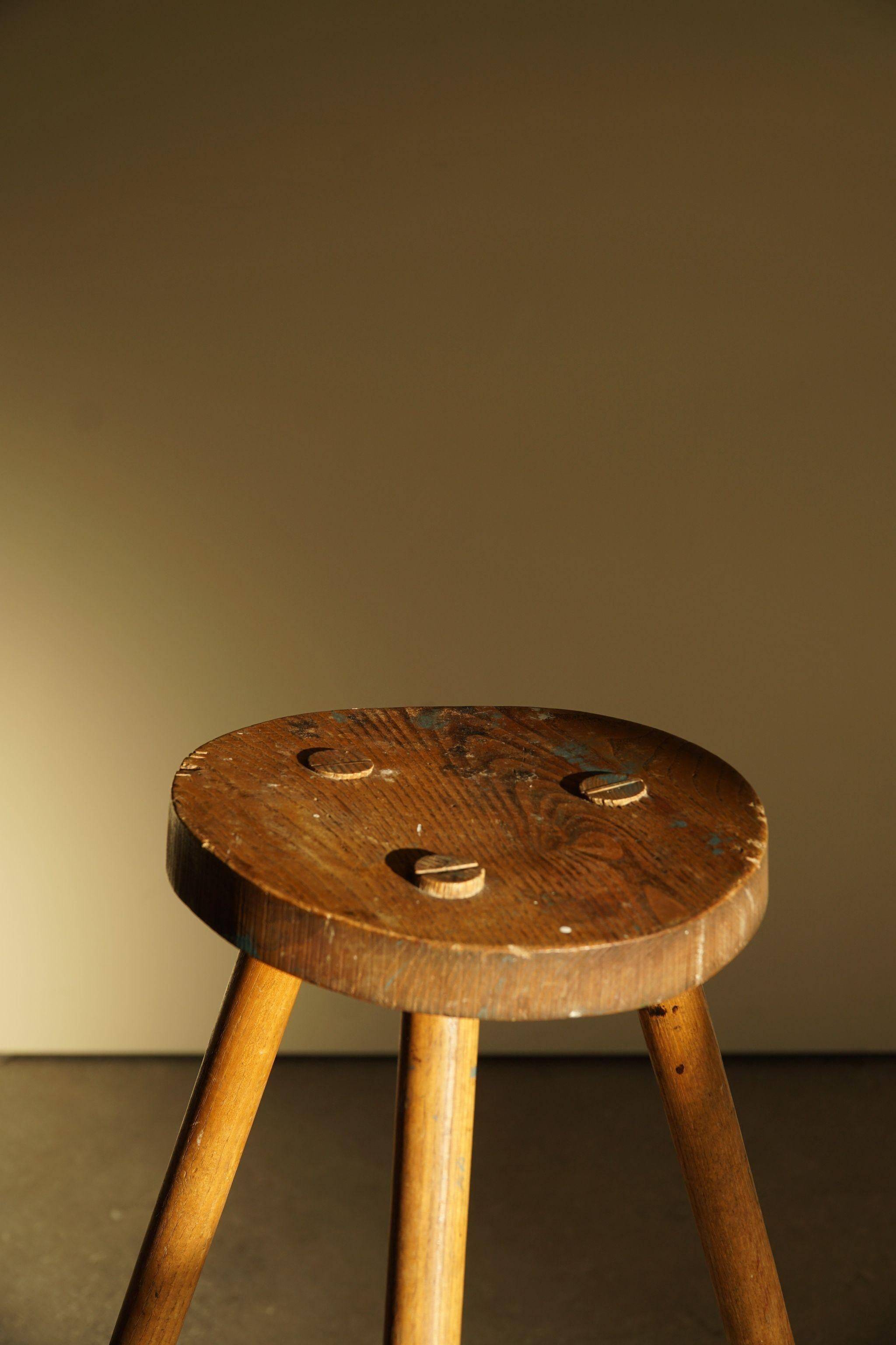 Tripod stool made of solid oak, by a Danish cabinetmaker, mid-century, around 1960.