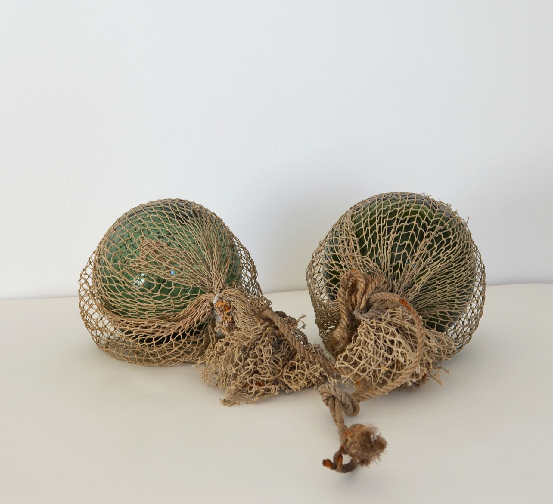 Two old glass floats