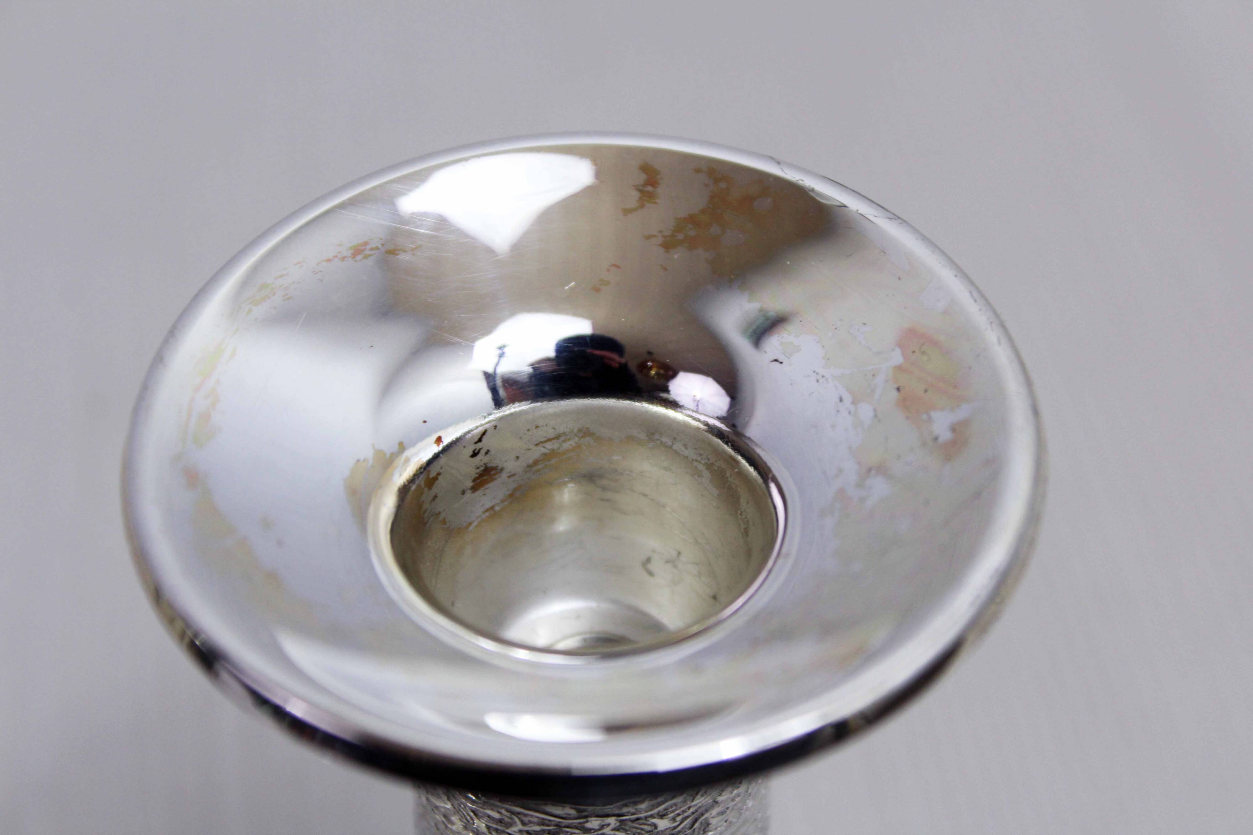 Pair of silver metal candlesticks