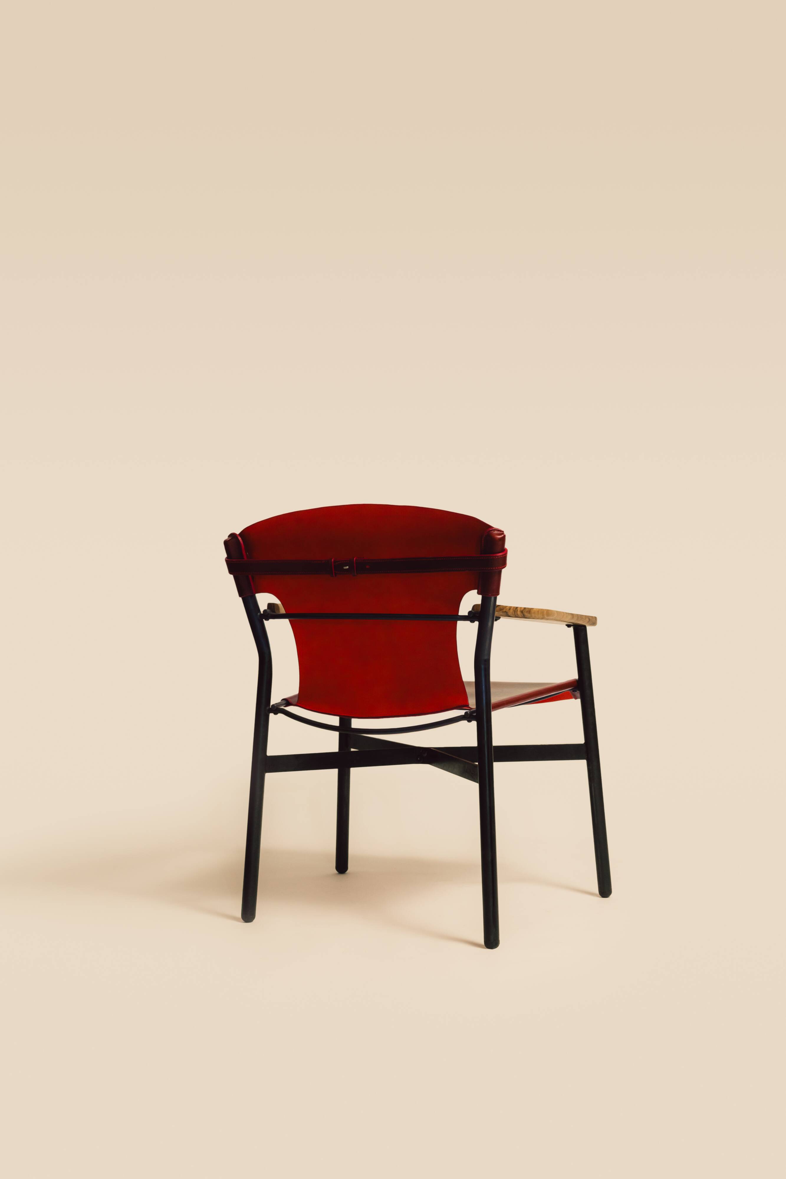 Maërl armchair, Galathée model, red leather, solid wood armrests of your choice