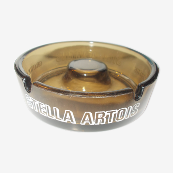Stella Artois advertising ashtray in smoked glass color
