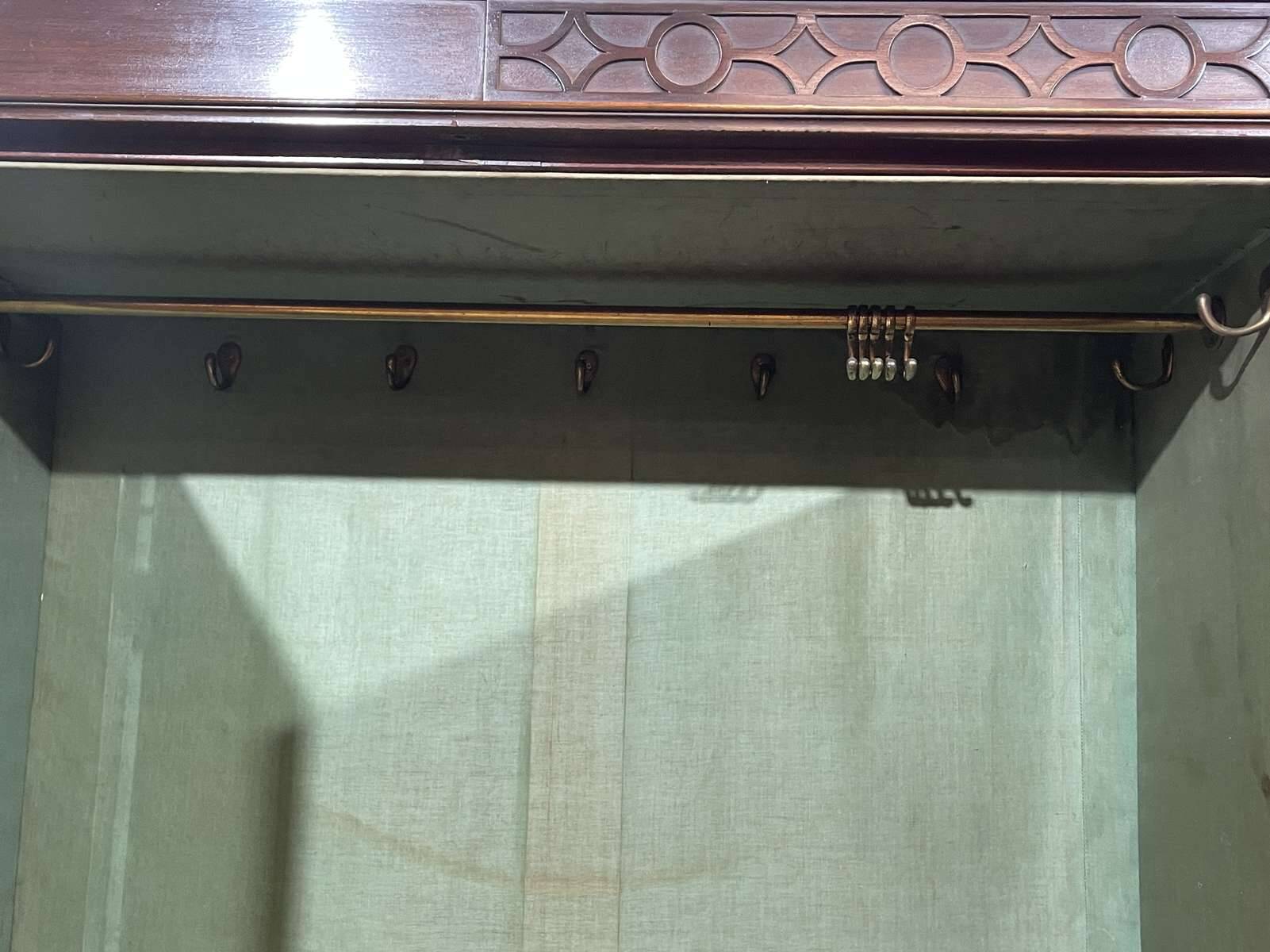 19th-century English mahogany three-door wardrobe.