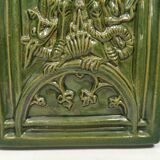 Antique tile in green faience, motif of Saint George and the dragon