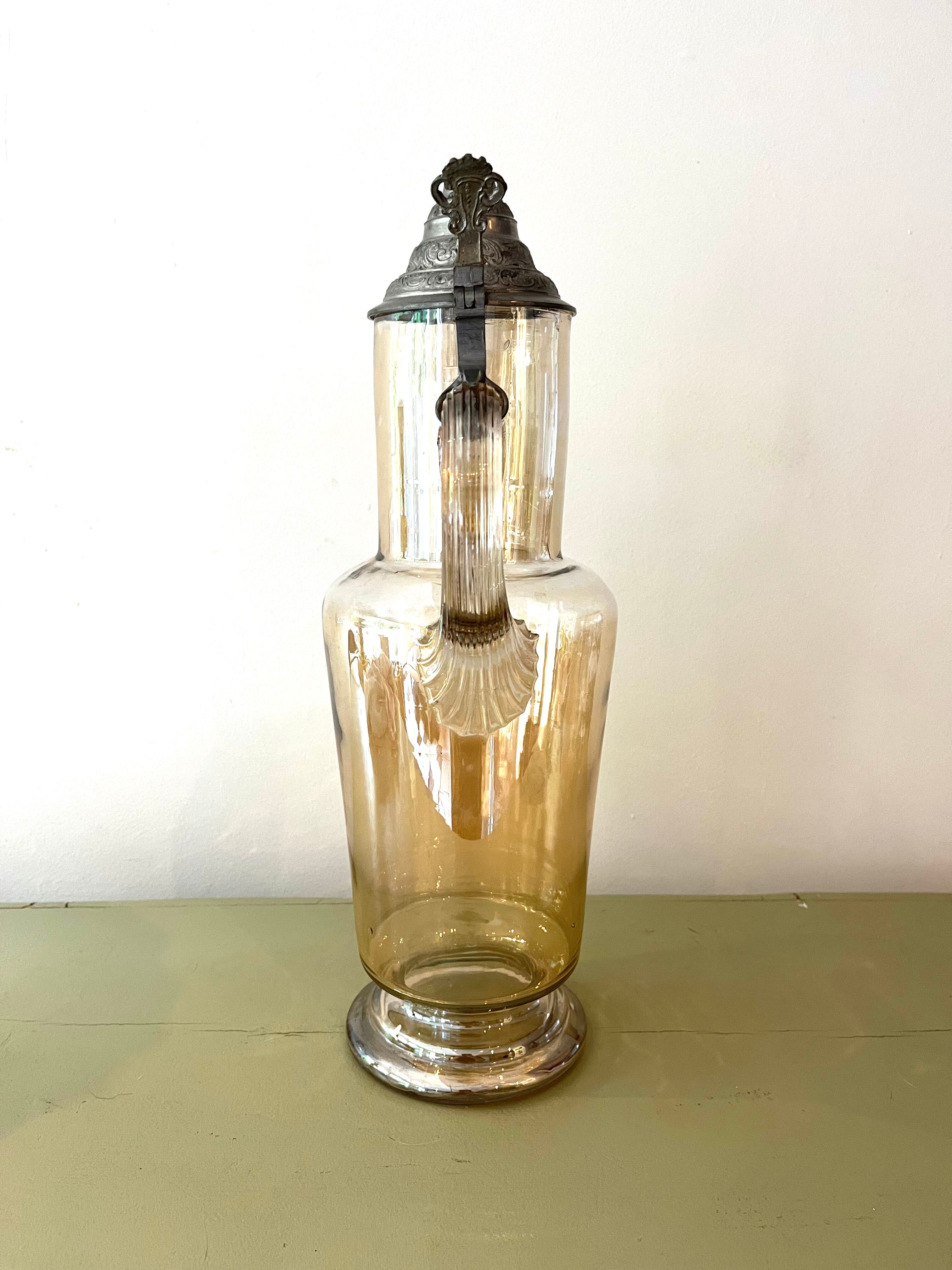 Vintage glass and tin jug