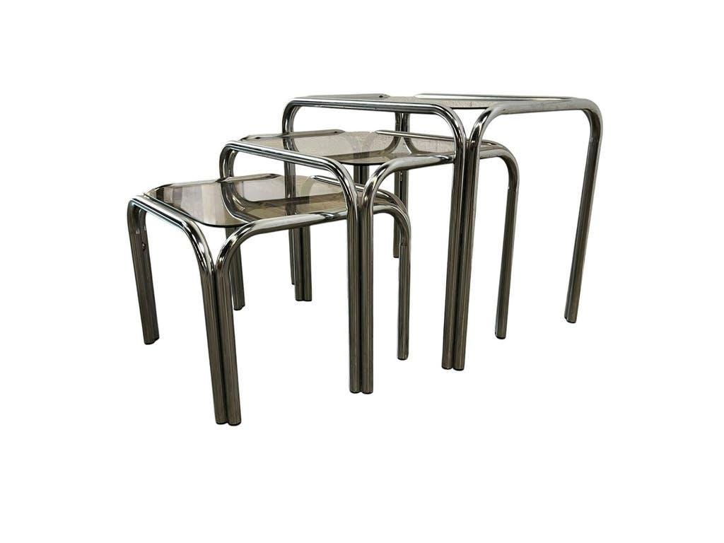 Set of 3 vintage chrome nesting tables with smoked glass.
