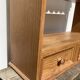 Wall shelf in raw wood with drawers and openwork hearts