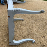 Louis XV style walnut table with a natural wood top.