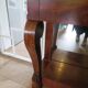 Empire/Restoration style console table with scrolled ends, mirrored back, and claw feet.