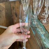Set of 7 champagne flutes. Made of cut crystal.