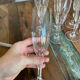 Set of 7 champagne flutes. Made of cut crystal.